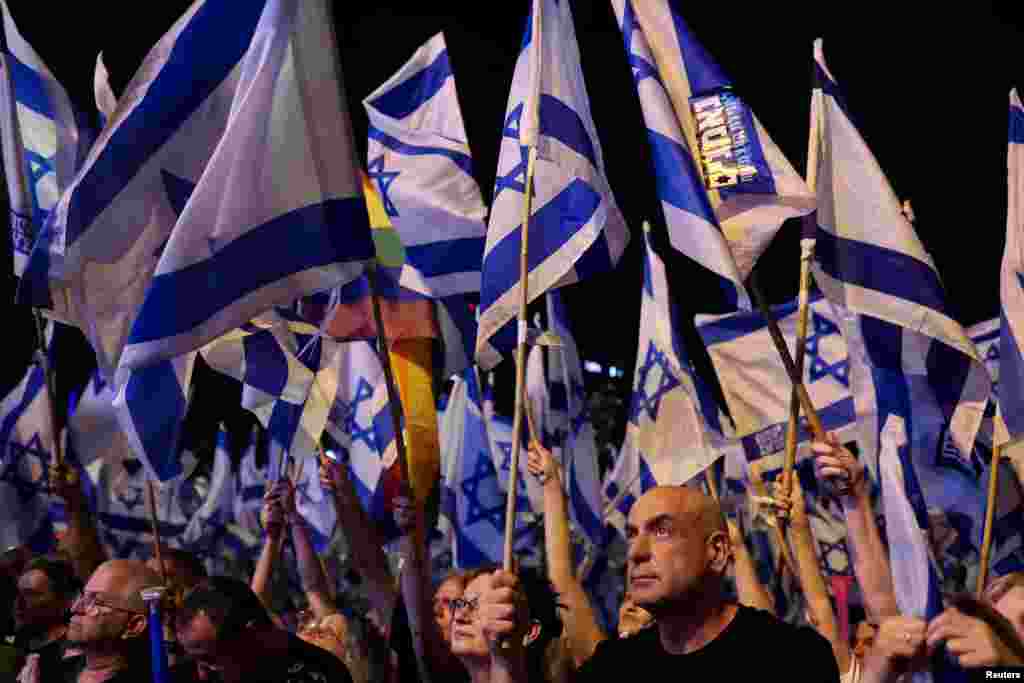 People take part in a demonstration against Israeli Prime Minister Benjamin Netanyahu and his nationalist coalition government's judicial overhaul, in Tel Aviv, June 17, 2023.