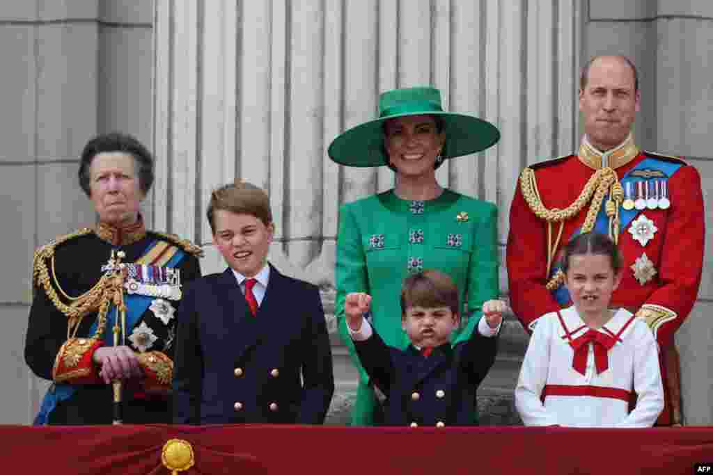 (L-R) Britain's Princess Anne, Prince George, Prince Louis, Catherine, Princess of Wales, Princess Charlotte and Prince William, Prince of Wales, watch the fly-past of aircraft by the Britain's Royal Air Force from the balcony of Buckingham Palace after attending the King's Birthday Parade, 'Trooping the Colour', in London, June 17, 2023. 