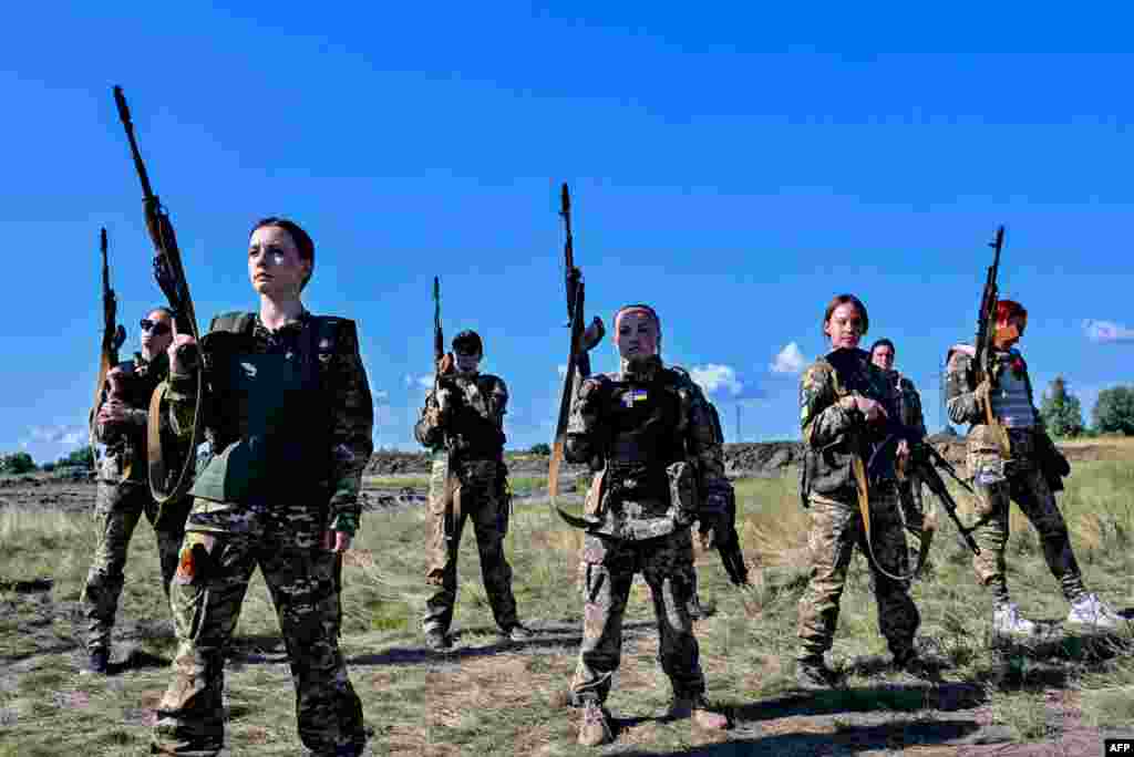 Female Ukrainian cadets, wearing new military uniforms designed specially for women, attend the "Uniform matters" event on the outskirts of Kyiv, July 12, 2023.