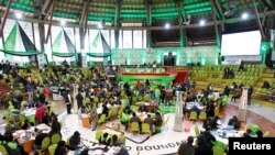 Various political parties' delegates and officials from the Independent Electoral and Boundaries Commission (IEBC) meet at the IEBC National Tallying centre at the Bomas of Kenya, in Nairobi, Aug. 13, 2022.