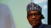Nigeria's President Muhammadu Buhari delivers a speech during a European Union and African Union summit in Brussels on Feb. 18, 2022. 