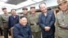 North Korean leader Kim Jong Un guides the test firing of a new weapon, in this undated photo released Aug. 11, 2019 by North Korea's Korean Central News Agency.