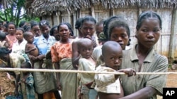 Madagascar mothers line up with their malnourished children to see a doctor in the island's southeast isolated district of Vangaindrano in this picture taken in Jan 2006