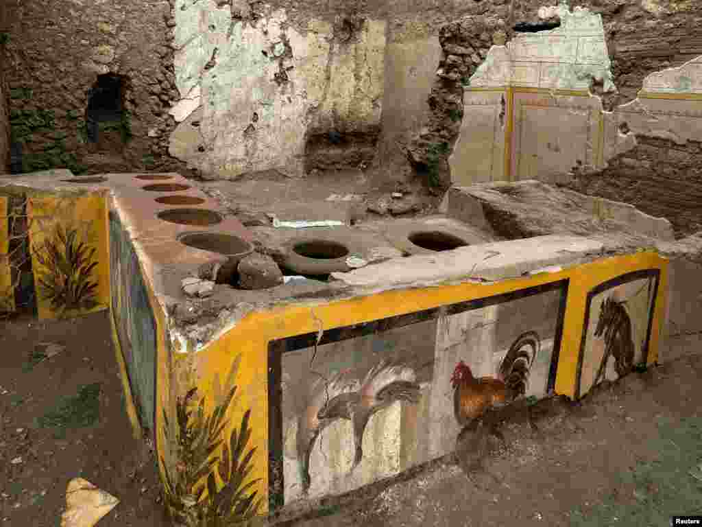 Frescoes on an ancient counter discovered during excavations in Pompeii, Italy, are seen in this handout picture released Dec. 26, 2020. (Pompeii Archaeological Park/Ministry of Cultural Heritage and Activities and Tourism/Luigi Spina)