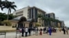 FILE - Journalists are stationed opposite the Federal High Court as they await the arrival of IPOB leader Nnamdi Kanu at the court in Abuja, Nigeria, July 26, 2021. 