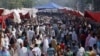 FILE - People visit a crowded market in Lahore, Pakistan, Oct. 30, 2011. In 2015, the World Bank estimated Pakistan's population at 188.9 million but Islamabad still uses a 1998 figure of 134.7 million.
