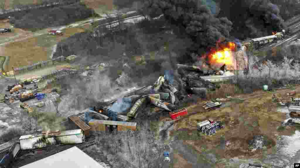 This photo taken with a drone shows portions of a Norfolk and Southern freight train that derailed Friday night in East Palestine, Ohio are still on fire at mid-day Saturday, Feb. 4, 2023.