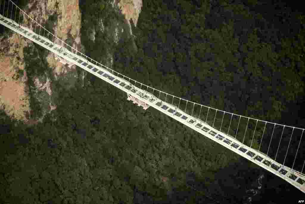 The world's highest and longest glass-bottomed bridge is seen above a valley in Zhangjiajie in China's Hunan Province.