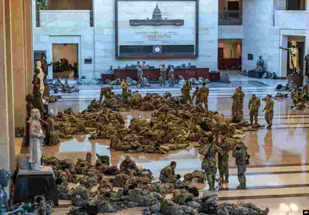 Hundreds of National Guard troops rest inside the Capitol Visitor's Center in Washington, D.C.
