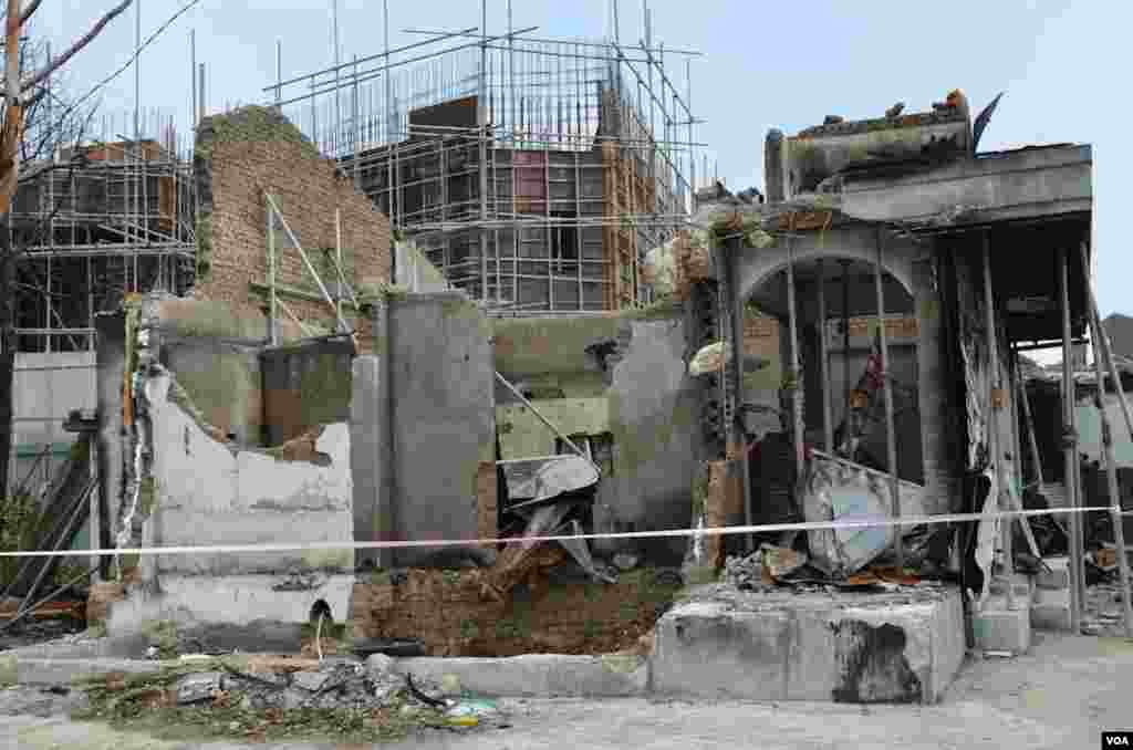 Several buildings damaged by the Nov. 23, 2010 are being left in that condition. (Photo: VOA / Steve Herman)