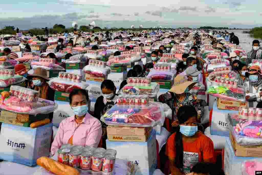 Flood survivors receive aid supplies provided by Cambodia's Prime Minister Hun Sen in Banteay Meanchey province.