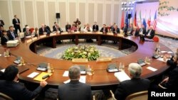 Participants from the U.S., Russia, China, France, Britain and Germany prepare to start talks with Iranian negotiators in Almaty, April 5, 2013.