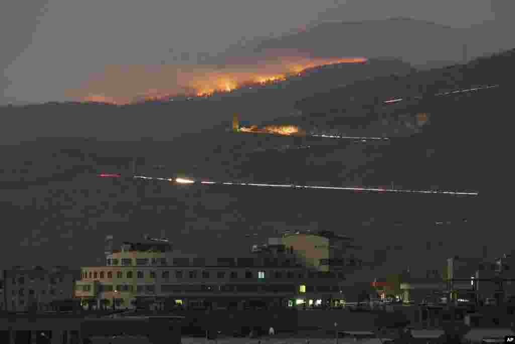 Forest in the mountains burns after shelling by Azerbaijan's artillery during a military conflict outside Stepanakert, the separatist region of Nagorno-Karabakh, Oct. 31, 2020.
