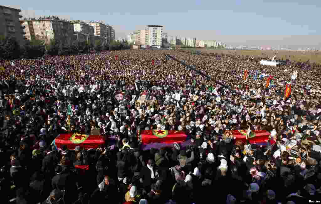 Thousands attend the funeral ceremony of the three Kurdish activists shot in Paris, in Diyarbakir, Turkey, January 17, 2013.