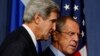 U.S. Secretary of State John Kerry and Russian Foreign Minister Sergey Lavrov, right, arrive for their press conference before their meeting to discuss the ongoing crisis in Syria, in Geneva, Sept. 12, 2013.