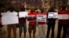 Nigerians take part in a protest, called by Malaga's Nigerian women Association, for the release of the abducted secondary school girls from the remote village of Chibok in Nigeria, at La Merced square in Malaga, southern Spain May 13, 2014. The leader of