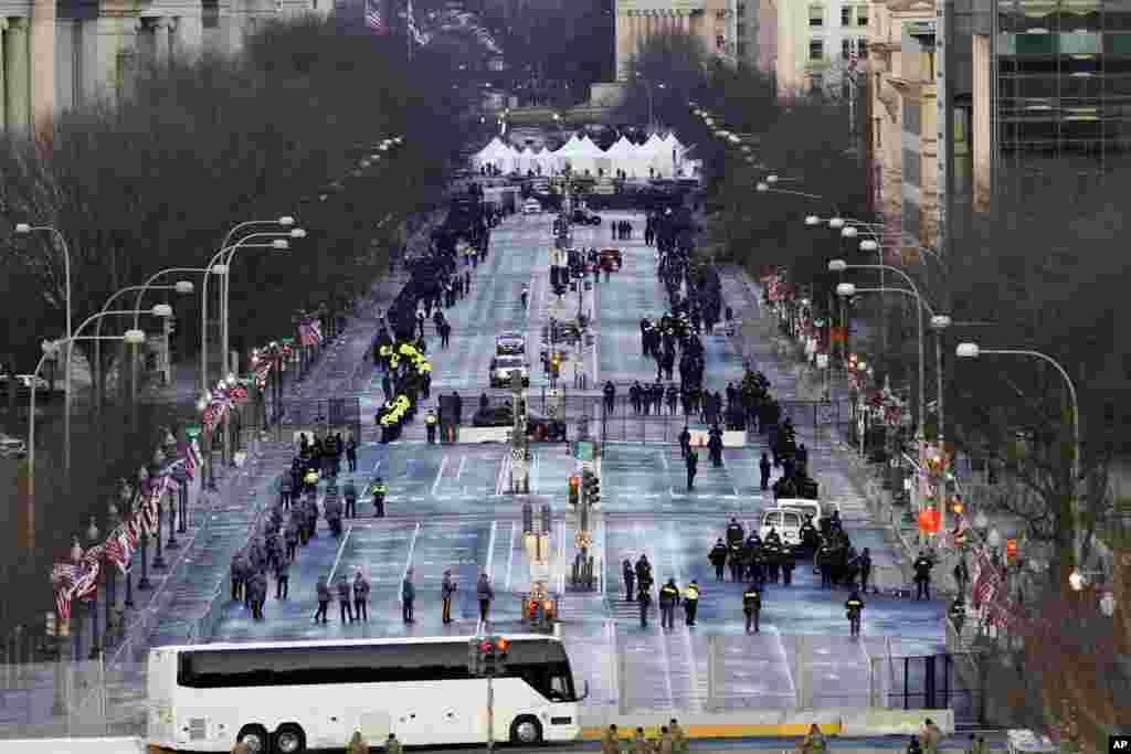 Security is set up along Pennsylvania Avenue before the inauguration at the U.S. Capitol in Washington.