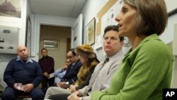 Elder abuse attorney and specialist Joy Solomon, right, speaks during a class at a condominium in New York, Jan. 7, 2014, on teaching doormen and building staff how to identify and what to do if they spot cases of elder abuse.