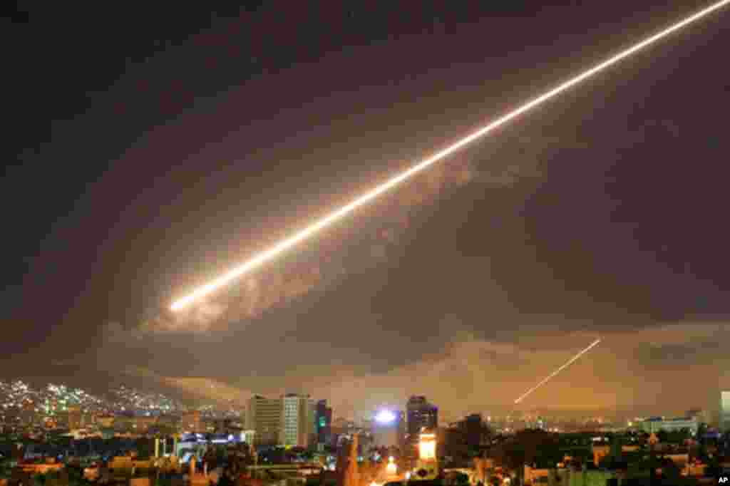 Damascus skies erupt with surface to air missile fire as the U.S. launches an attack on Syria targeting different parts of the Syrian capital Damascus, April 14, 2018. Syria's capital has been rocked by loud explosions that lit up the sky with heavy smoke as U.S. President Donald Trump announced airstrikes in retaliation for the country's alleged use of chemical weapons.