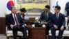 South Korean Unification Minister Kim Yeon Chul, right, and U.S. Special Representative for North Korea Stephen Biegun, left, talk during their meeting at a government complex in downtown Seoul, South Korea, Wednesday, Aug. 21, 2019. 
