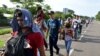 Migrants from Central America walk on a highway during their journey towards the United States, in Ciudad Hidalgo, Chiapas state, Mexico, June 5, 2019.