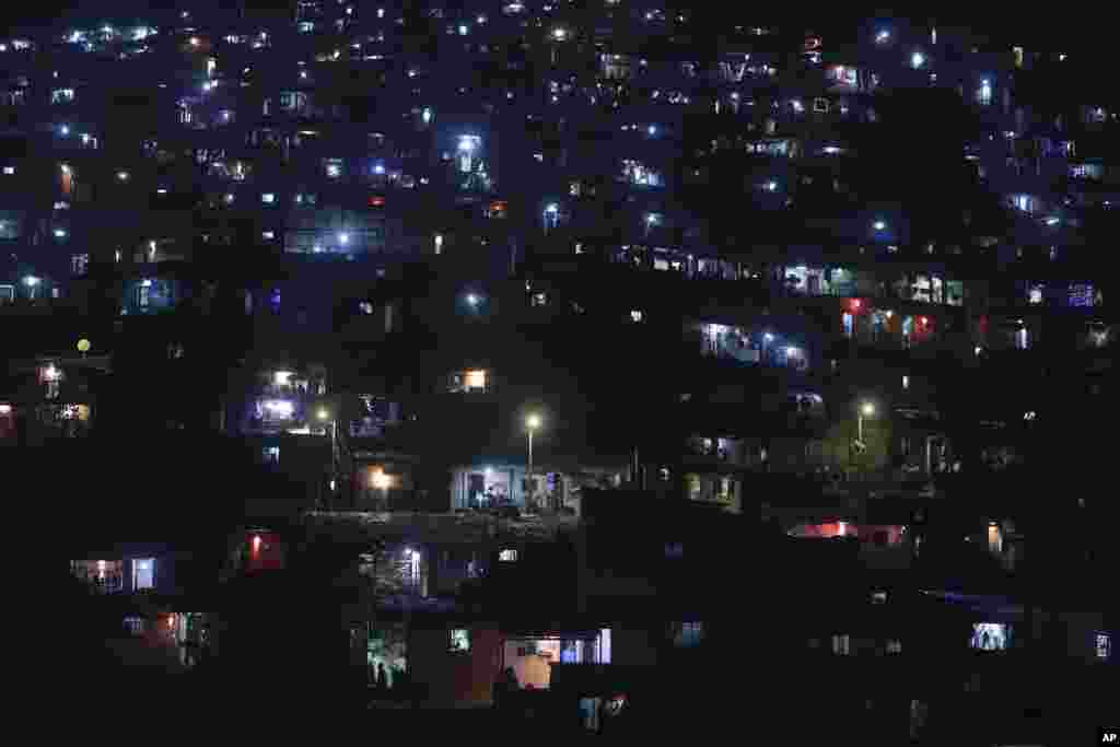 A slum colony is decorated with lanterns and lights as they celebrate Diwali, the Hindu festival of lights, in Mumbai, India.
