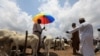 FILE - Men are seen at a livestock market, amid the spread of the coronavirus disease (COVID-19), in Abuja, Nigeria, July 29, 2020. 