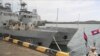 FILE - Cambodian navy troop members stand on a navy boat at Ream Naval Base in Sihanoukville, southwestern of Phnom Penh, Cambodia on July 26, 2019. (AP Photo/Heng Sinith)