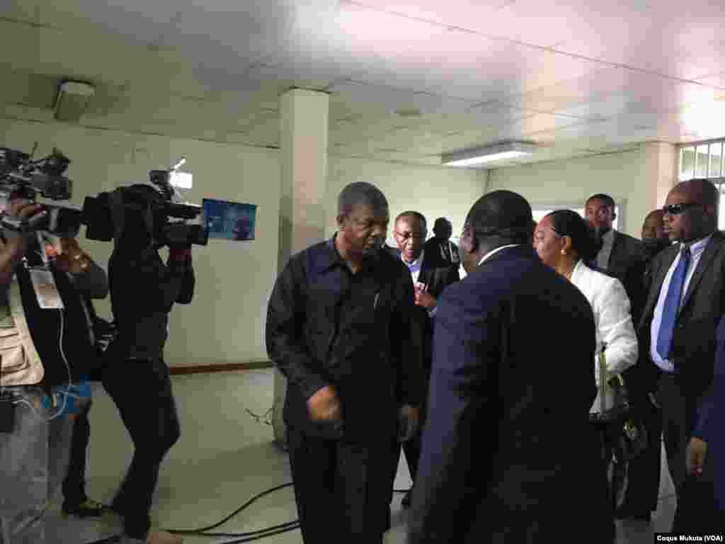 The MPLA party's presidential candidate, João Lourenço, arrives at a polling station in Luanda. Standing behind him are his wife and MPLA's vice presidential candidate, Bornito de Sousa.