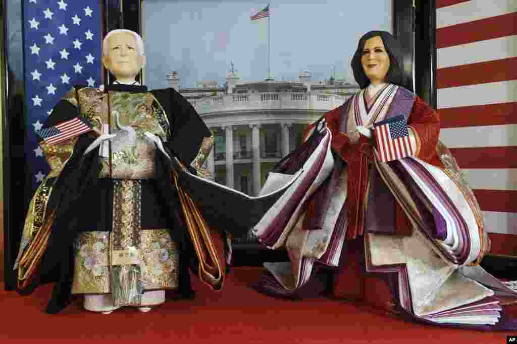 "Hina" dolls depicting U.S. President Joe Biden and Vice President Kamala Harris are displayed for Girls' Day celebrations at Kyugetsu, a Japanese traditional doll company, Tokyo.