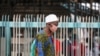 FILE - A man wearing a protective face mask is seen on the first day of the easing of coronavirus lockdown measures, in Lagos, Nigeria, May 4, 2020. 