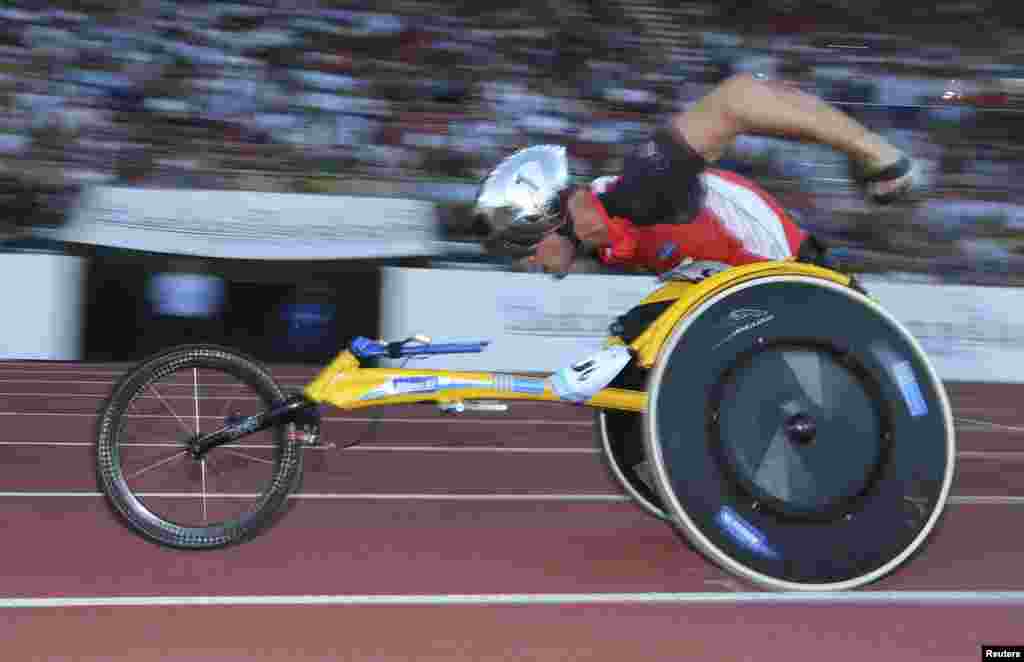 Marcel Hug of Switzerland competes in the men's 1,500m wheelchair competition at Stade Olympique de la Pontaise, Lausanne, Switzerland.