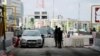 FILE - Cars drive through the Lekki toll gate, a site where soldiers had opened fire on protesters late on Tuesday, as Nigeria's Lagos state eases a round-the-clock curfew imposed in response to protests against alleged police brutality, Oct. 24, 2020. 