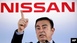 FILE - Former head of Nissan Motor Co., Carlos Ghosn speaks during a press conference in Yokohama, near Tokyo, May 11, 2012. (AP Photo/Koji Sasahara, File)