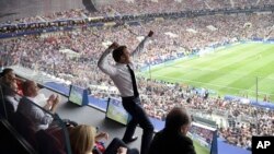 French President Emmanuel Macron reacts during the final match between France and Croatia at the 2018 soccer World Cup in the Luzhniki Stadium in Moscow, July 15, 2018. 