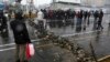 FILE - A road is blocked by protesters after authorities raised gasoline prices, in Tehran, Iran, Nov. 16, 2019.