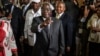 Afonso Dhlakama, a former Renamo rebel chief turned opposition leader, shows his ink-stained finger after casting his ballot at a polling station in Maputo, October 15, 2014.