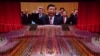 资料照：中国共产党成立100周年前夕的一场庆祝活动上，屏幕显示国家主席习近率领官员诵读对党的效忠誓词。（2021年6月28日，美联社）