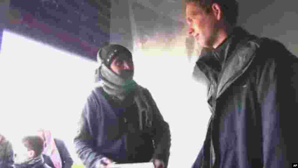Dutch student Wijbe Abma, 21, right, has raised more than $17,000 to buy warm blankets for the Syrian refugees, delivering the aid through local activists and rebel groups.