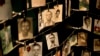 Family photographs of some of those who died hang in a display in the Kigali Genocide Memorial Centre in Kigali, Rwanda, April 5, 2014. 