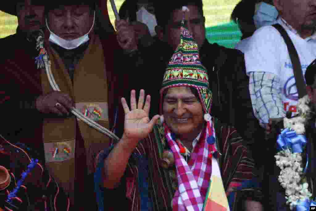 Former President Evo Morales waves his supporters during a rally in Villazon, Bolivia, after he walked across a border bridge from Argentina.