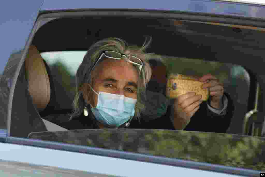 Marion Koopmans of the World Health Organization team of researchers looks out from a car during a field trip in Wuhan in central China's Hubei province.
