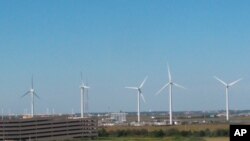 This Oct. 1, 2020 photo shows windmills at a utility plant in Atlantic City N.J. On Nov. 18, 2020, New Jersey committed itself to building a transmission system capable of handling enough offshore wind energy to power 3.2 million homes. 