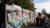 FILE - Remains of the Berlin Wall are pictured at former Bornholmer Strasse Berlin Wall border crossing point in Berlin, Germany, Oct. 18, 2019.