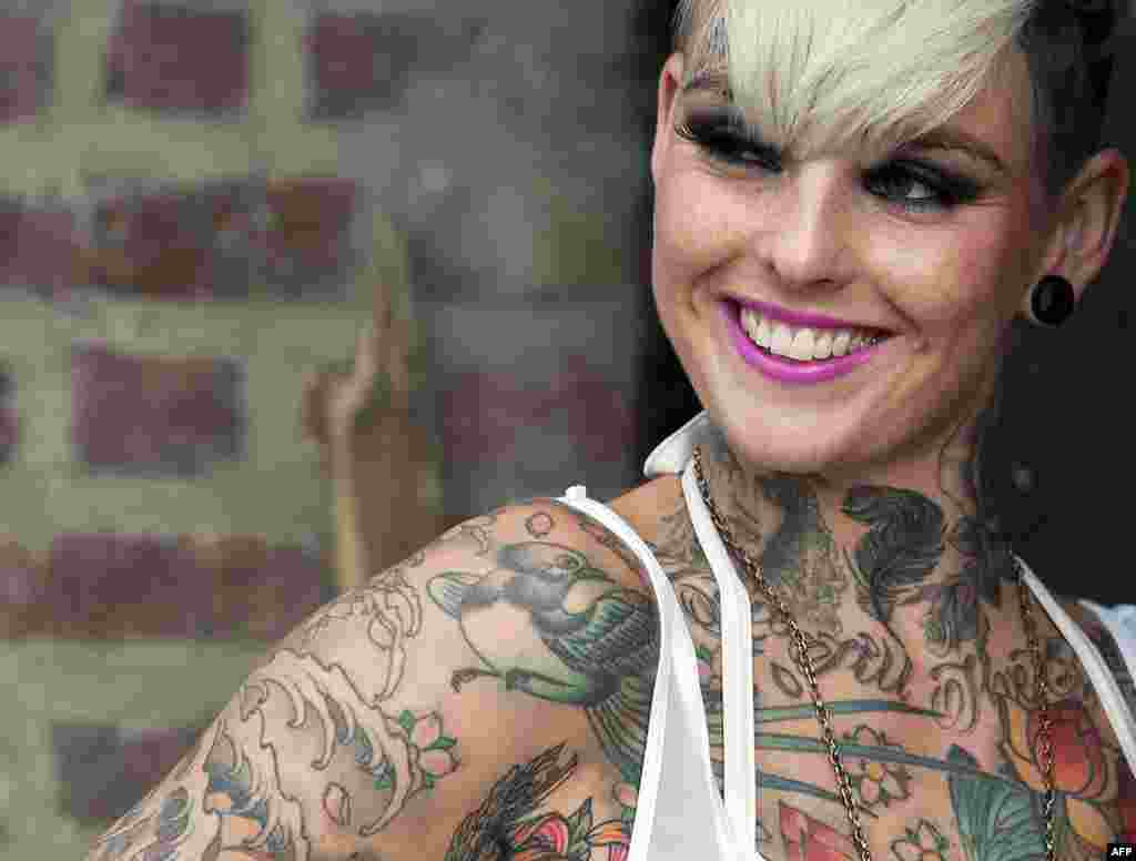 A tattoo enthusiast poses at the London Tattoo Convention in London, Sept. 29, 2013.