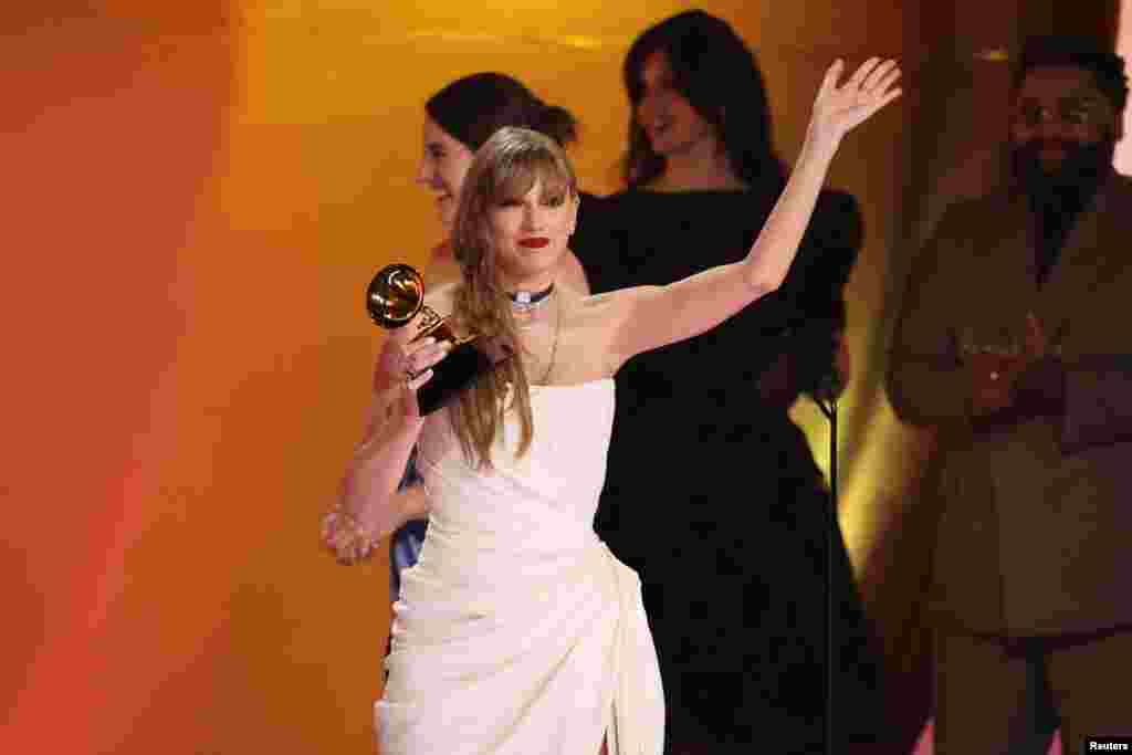 Taylor Swift accepts the award for Album of the Year for Midnights during the 66th Annual Grammy Awards in Los Angeles, California, Feb. 4, 2024. 