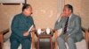 资料照片：1987年，中国前副总理习仲勋(左)在北京与达赖喇嘛的胞兄嘉乐顿珠交谈。