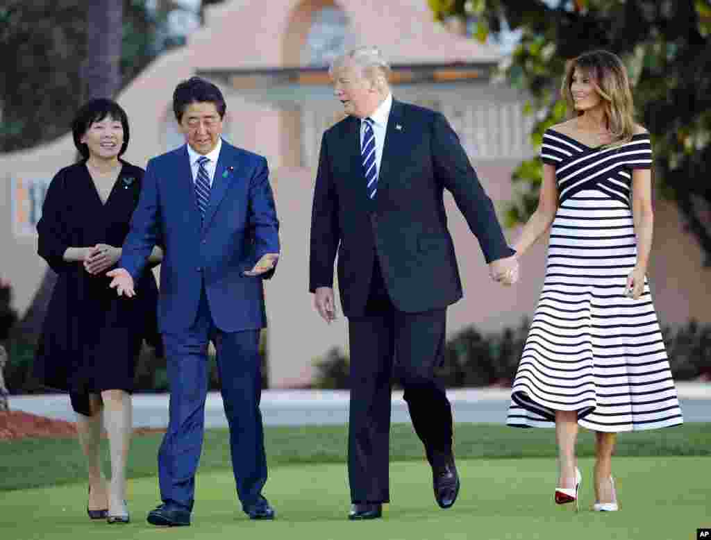 President Donald Trump, first lady Melania Trump, Japanese Prime Minister Shinzo Abe and his wife, Akie Abe, walk at Trump's private Mar-a-Lago club, April 17, 2018, in Palm Beach, Florida.