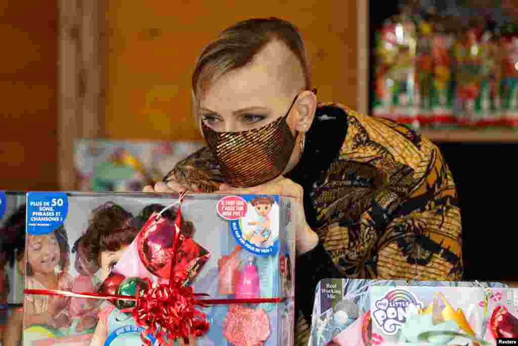 Princess Charlene of Monaco, wearing a protective face mask, attends the traditional Christmas tree ceremony at the Monaco Palace.