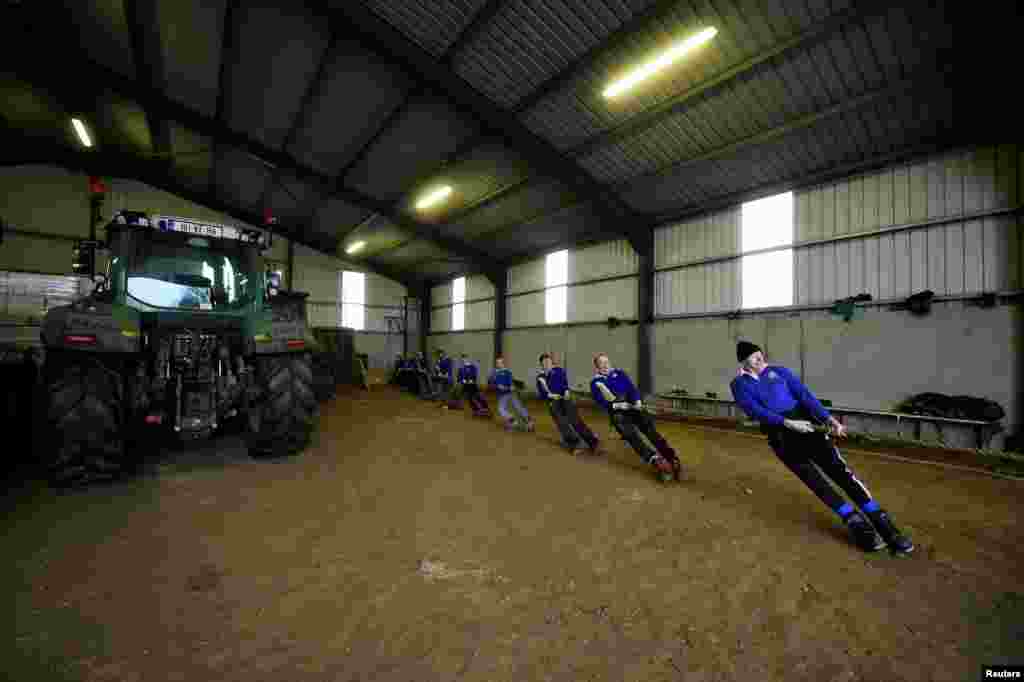 Tug of War champion and farmer James Kehoe, 63, of Boley Tug of War Club trains at home in his barn with teammates after being nominated as the "greatest athlete of all time" for the World Games awards, in County Tipperary village of Boley, Ireland, Jan. 27, 2021.